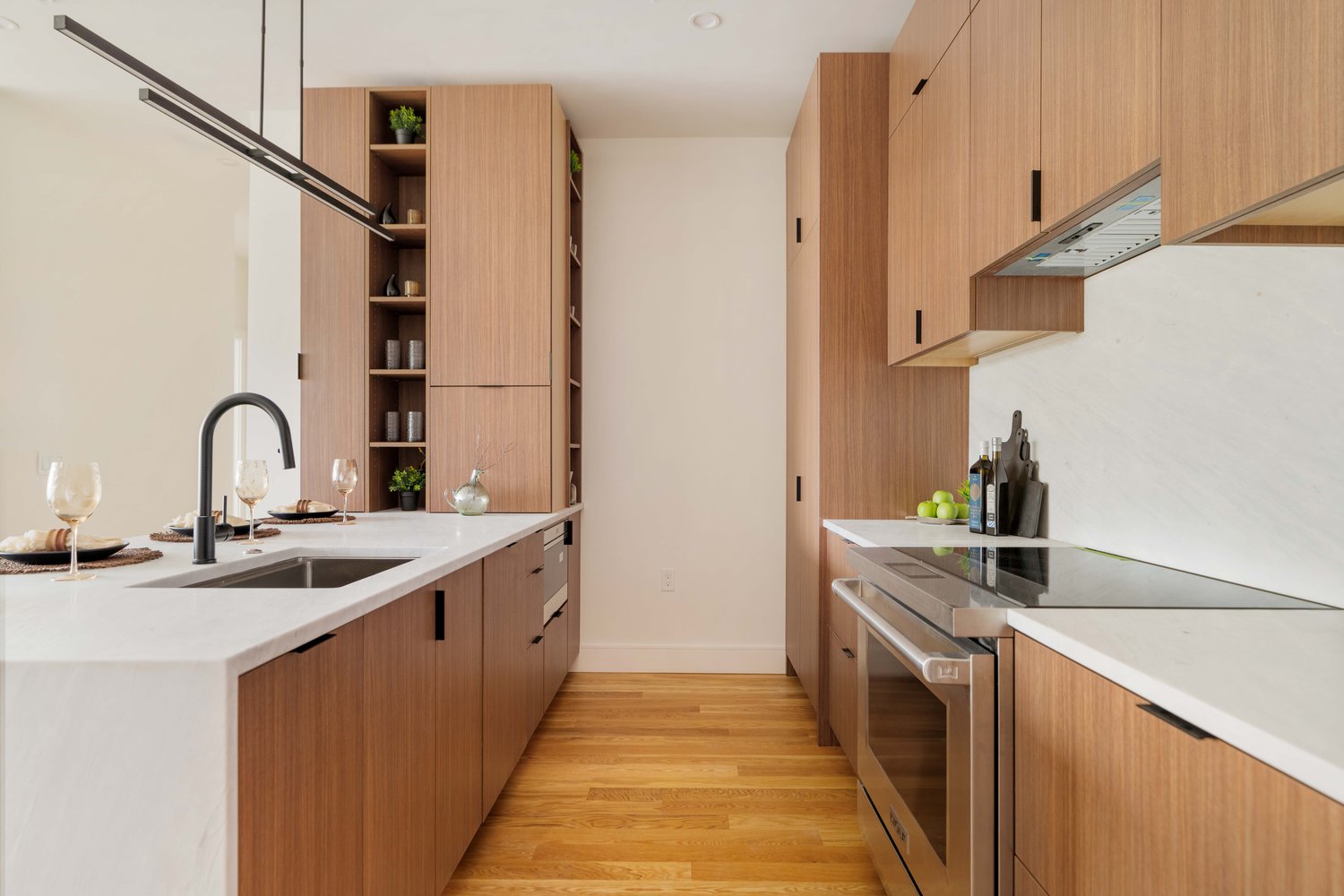 Kitchen island and custom wood millwork in Brookline Village condo at 58 Kent – modern luxury finishes Kitchen island and custom wood millwork in Brookline Village condo at 58 Kent – modern luxury finishes